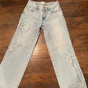 women’s low rise baggy bow jeans